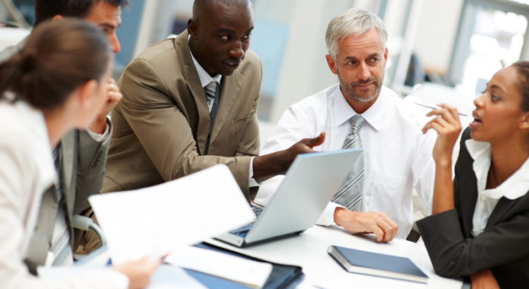 Photo of a creative business team busy at a meeting
