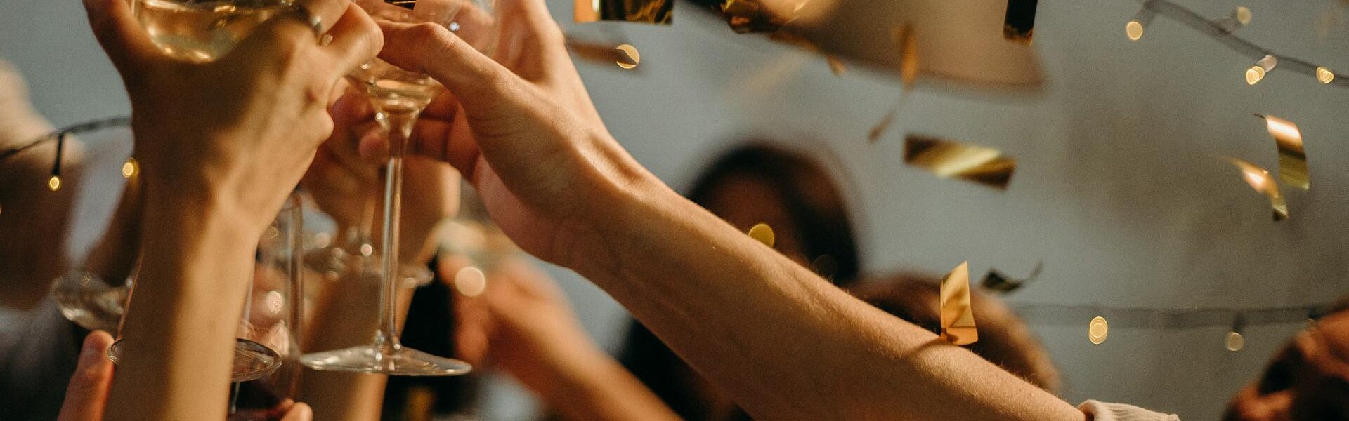 Clinking glasses in a new years celebration