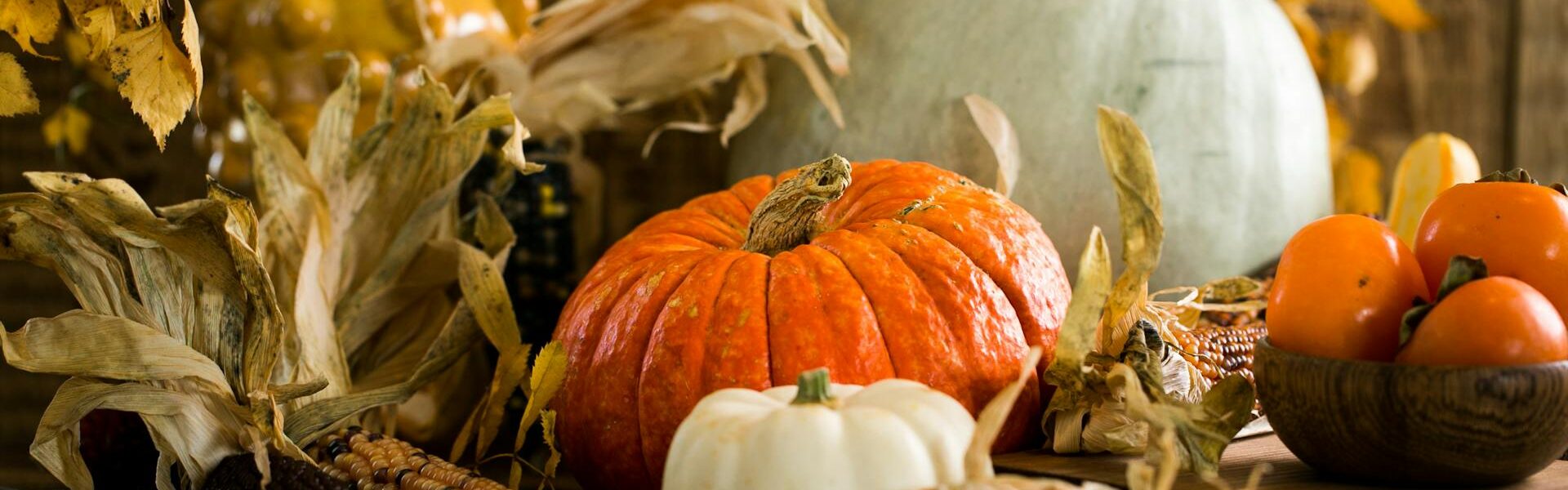 Pumpkins and other fall items on a table