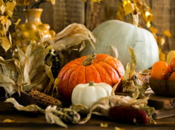 Pumpkins and other fall items on a table