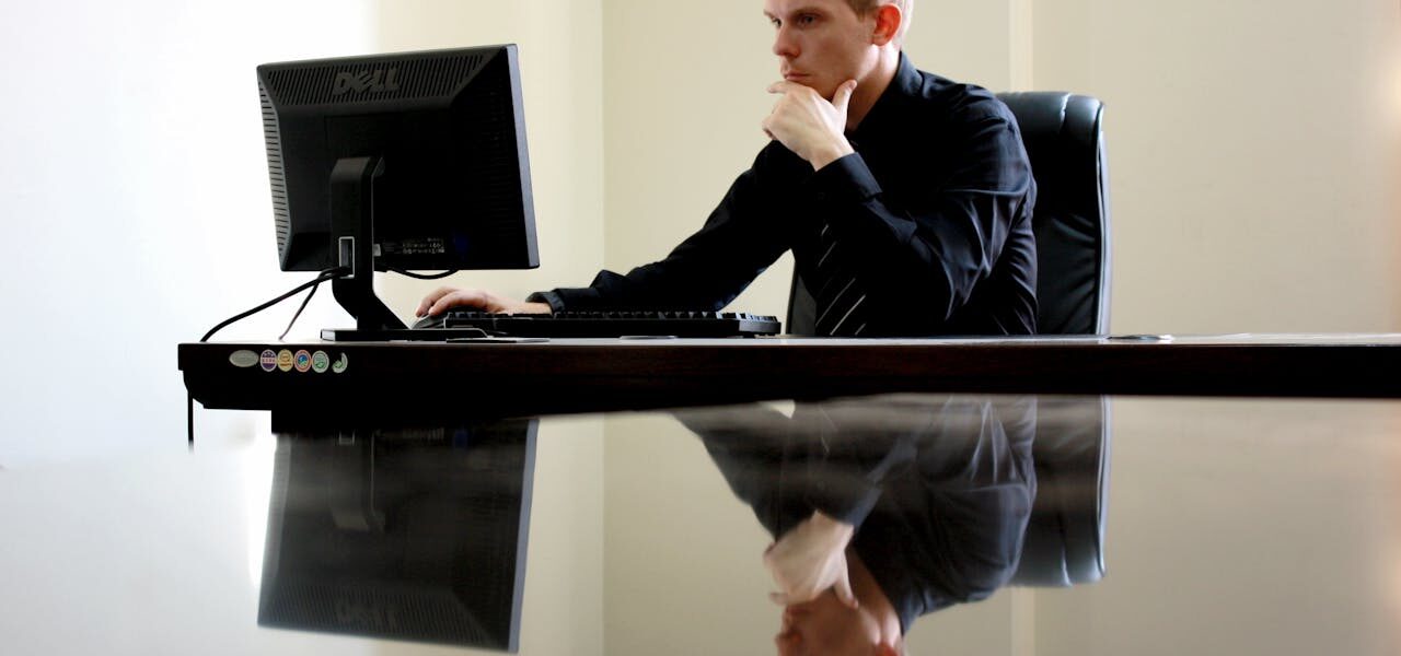 Man working on his computer at work