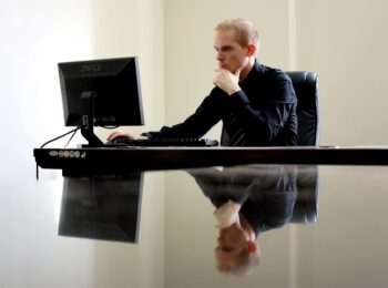 Man working on his computer at work